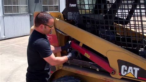 manually raising skid steer arms|cat 226b skid steer lift arms.